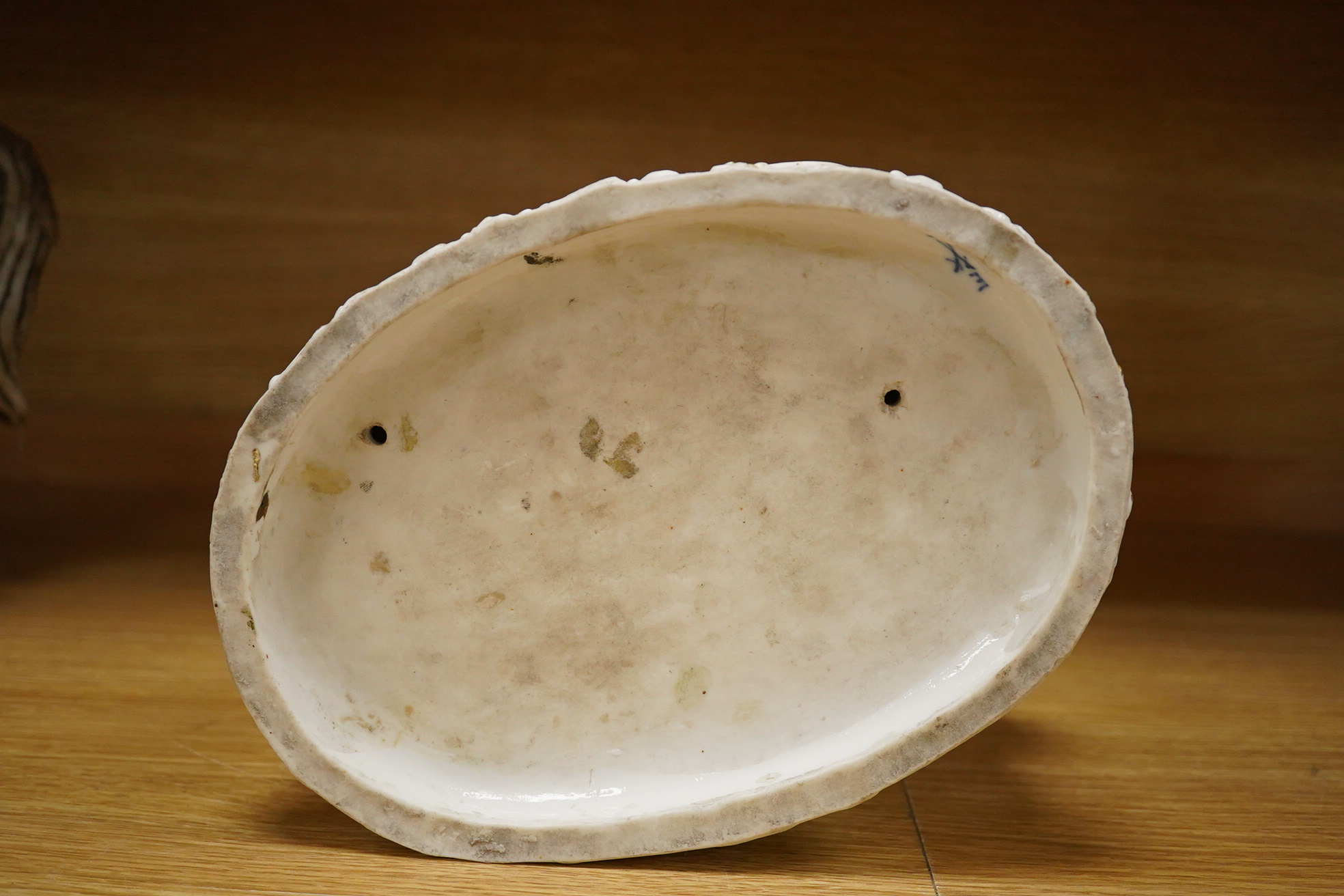 A 19th century Dresden porcelain group of three figures at a table, 24cm high